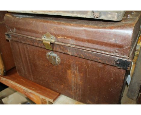 Two tin trunks, the smaller trunk with wood effect finish, 55cm and 60cm wide (2)