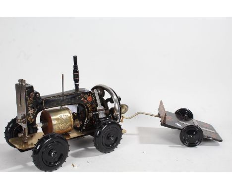 Novelty adapted sewing machine with engine, four wheel and a trailer