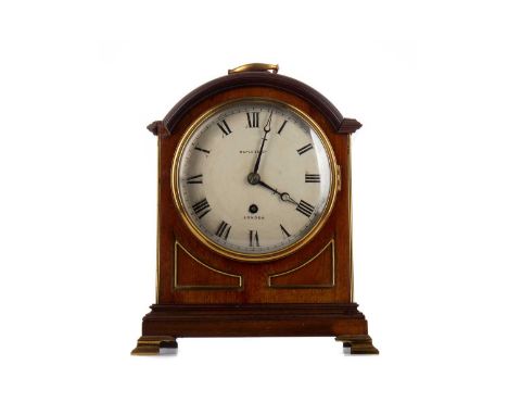 EDWARDIAN MAHOGANY AND BRASS MOUNTED MANTEL CLOCK,by Maple &amp; Co Ltd London, the circular dial set with Roman numerals, on