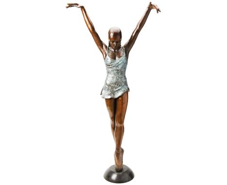 A BRONZE BALLERINA STANDING 'EN POINTE' patinated in two tones; 20th century, marked WM 8/9 112 cm high