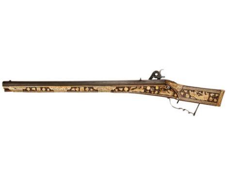 A RARE GERMAN OR AUSTRIAN WHEEL-LOCK RIFLE octagonal barrel, stag horn or bone profusely inlaid and engraved with mythologica