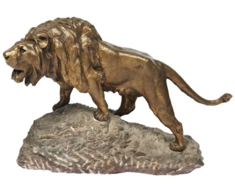 AFTER PROSPER LECOURTIER LION RUGISSANT a large bronze sculpture on a naturalistic stone outcrop base signed 'Lecourtier' in 