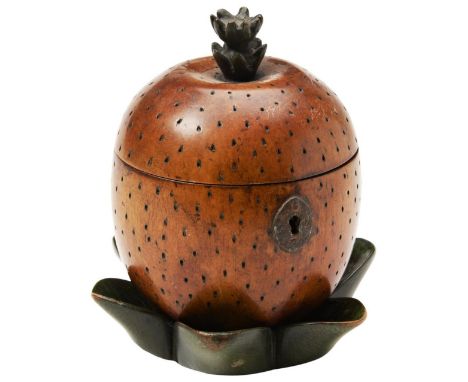 A GEORGE III STYLE TEA CADDY  in the form of a pineapple with stained finish ?dimple? effect to the body with leaf-shaped sep