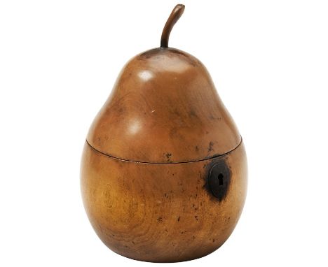 A GEORGE III STYLE PEAR SHAPED FRUIT WOOD TEA CADDY the lid with a carved stalk, a steel escutcheon and heavily degraded foil