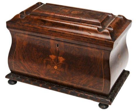 A LARGE VICTORIAN WALNUT TEA CADDY of bombe form the shaped lid with inlay, the base with carved trefoil border, the interior