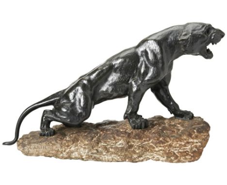 AFTER THOMAS-FRANCOIS CARTIER A FRENCH BRONZE MODEL OF A PANTHER EARLY 20TH CENTURY on a naturalistic stone 'outcrop' base, s