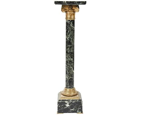 A 19TH CENTURY SERPENTINE COLUMN the square top over an architectural bronze embellished capital, the bronze mounted square b