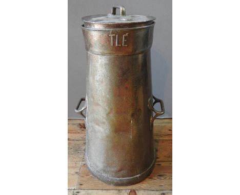 A NESTLÉ MILK CHURN embossed on the churn (Name not fully formed) and on the lid; used as a stick stand 74 cm high 