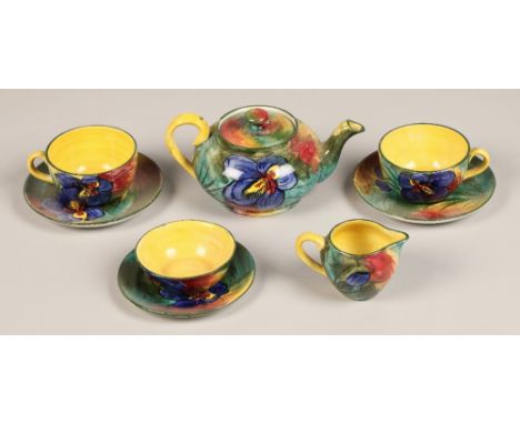 Wemyss 'Iris' pattern tete-a-tete tea set including tea pot, two cups and saucers, creamer, dish and sugar bowl, marked 'Wemy