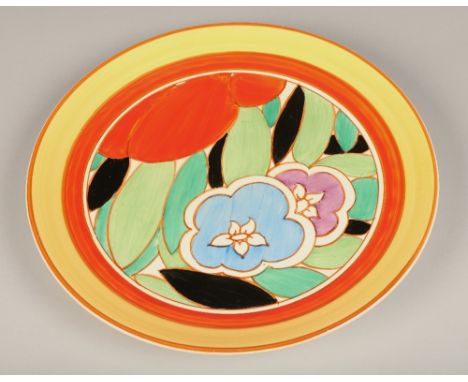 Clarice Cliff Fantasque Bizarre wall charger, decorated in bright colours, diameter 34cm.Condition Report: Some scratches to 