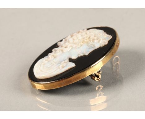 Ladies 9ct yellow gold mounted opal cameo brooch. 