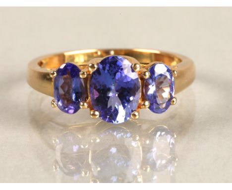 Ladies 18ct yellow gold three stone tanzanite ring, ring size M. 