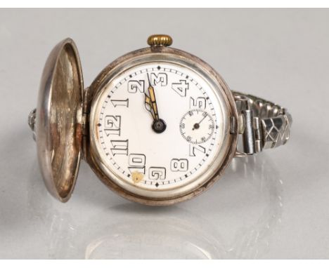 Rolex silver full hunter officers wrist watch. White numbered dial with subsidiary dial. Hinged lid stamped Rolex W &D BREVET