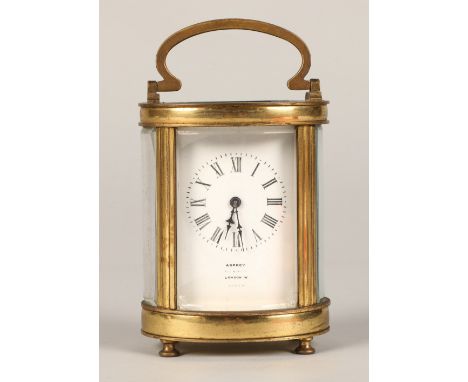 Asprey brass carriage clock, 13cm high. 