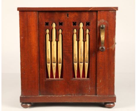 A 19th century miniature chamber barrel organ, playing eight tunes on twelve keys with one rank of stopped wooden pipes, the 