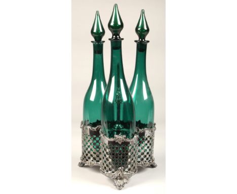 Two silver plated decanter stands, with three glass decanters each. Condition Report: Very slight nibble to top of one of the