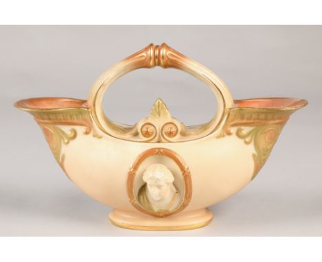 Royal Worcester double ended flower basket with oval relief mask panels in the classical style, 19cm high. 
