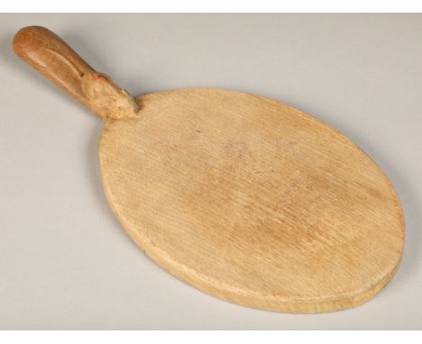 Robert Thompson of Kilburn (1876-1955), "Mouseman", carved oak cheese board with short handle, 37cm long. 