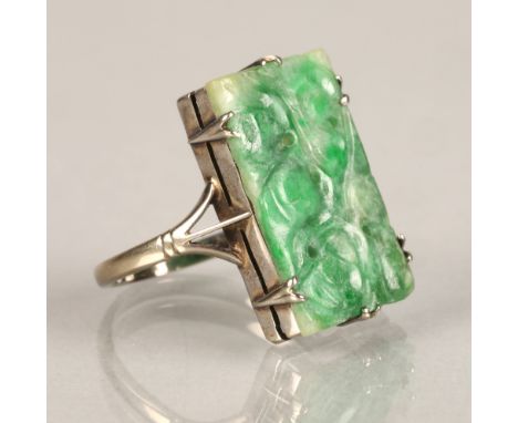 Ladies carved jade ring,mounted on white metal, ring size L/M. 