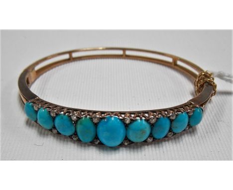 Good Edwardian turquoise and diamond hinged bangle set with nine graduated oval shaped turquoise cabochons each separated wit