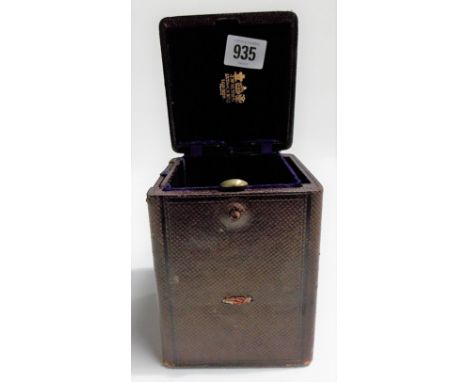 A Moroccan leather carriage clock travelling case by J.W. Benson.