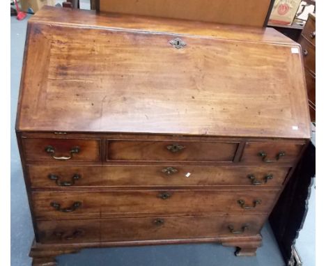 George III mahogany bureau, the fall front enclosing a fitted interior with concealed compartments and a central marquetry do