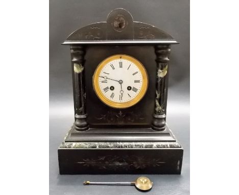 Black slate and marble two train mantel clock with French movement, height 13.25in.