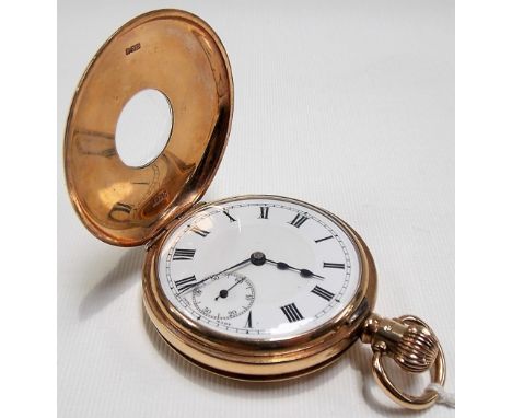 9ct gold half hunter crown wind pocket watch, the white enamel dial with Roman Numerals and subsidiary seconds dial, the move