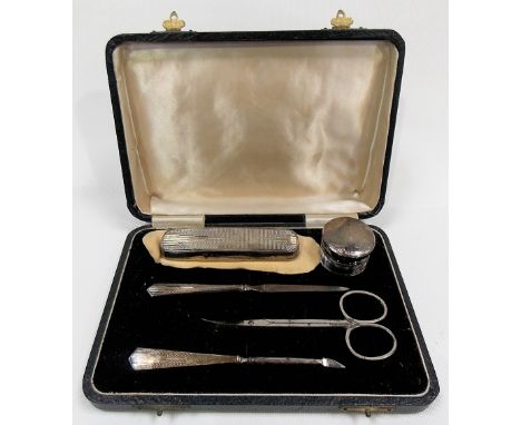 Engine turned five-piece manicure set within fitted case, stainless steel scissors