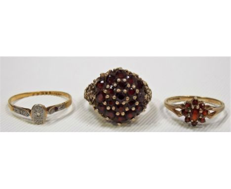 18ct gold and platinum diamond chip ring, weight 1.6g approx; together with two 9ct garnet set cluster rings, weight overall 