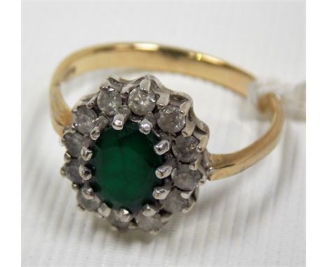 9ct gold diamond and emerald ring, the diamonds of 0.03ct spread approx, the weight 3.3g approx