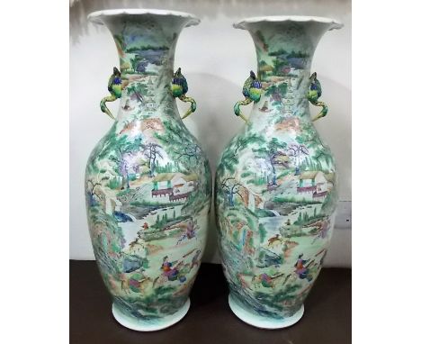 Good pair of Chinese famille verte vases, both with twin bird handles, both painted with hunting scenes amongst a mountainous
