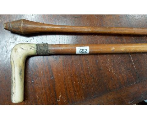 Possibly a tribal throwing club, with bulbous scratch carved end, length 42'; together with a walking stick with antler handl