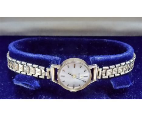 1960's 9ct gold ladies Tissot manual wind wristwatch with silvered dial with baton markers, gold plated strap within original