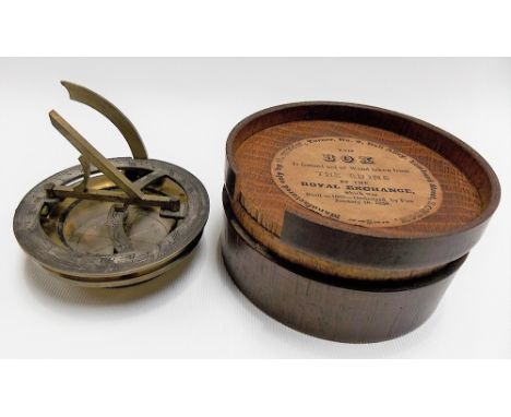 A brass lacquered folding sundial compass, with silvered dial and compass, unsigned, diameter 2.5in; together with a turned w