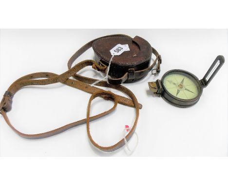 A brass compass by Stanley, CT Turnstyle, Holborn, London with printed paper dial and original leather case