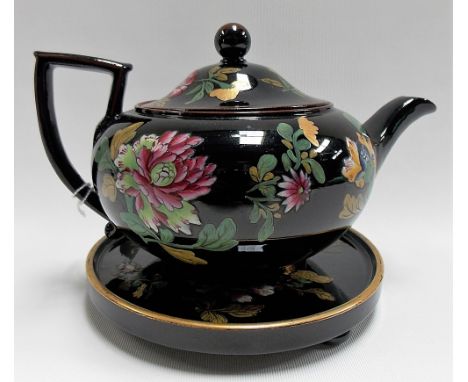 Early 19th Century Wedgwood black glazed teapot and foliate enamel decorated cover and stand, impressed marks, (damage to spo