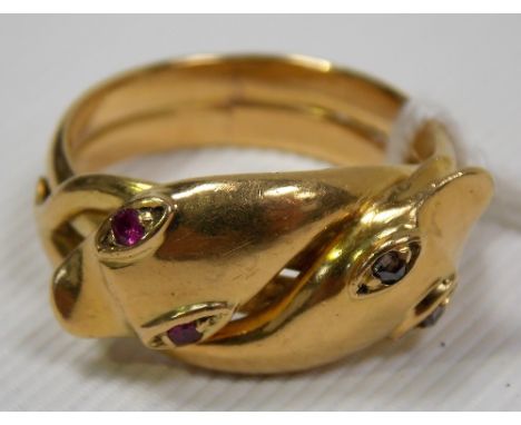 18ct gold snake twist ring, the twin heads set with diamond and ruby eyes, stamped 18, weight 10.7g approx.