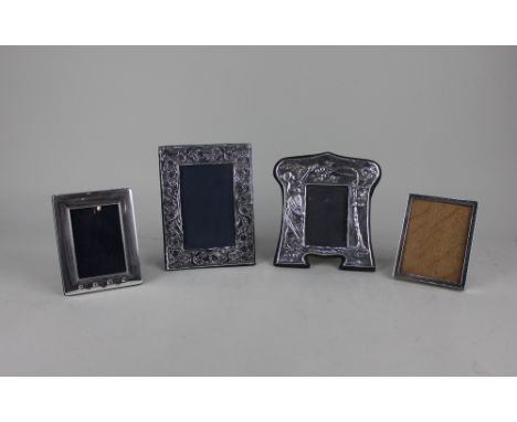 A George V silver photograph frame plain rectangular shape 11cm and three other modern silver photograph frames including one