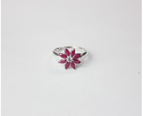 A 9ct white gold ruby and sapphire flower shaped ring 