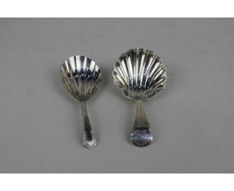 Two George III silver caddy spoons with shell shaped bowls maker Thomas Streetin London 1803 and the other by Samuel Godbeher