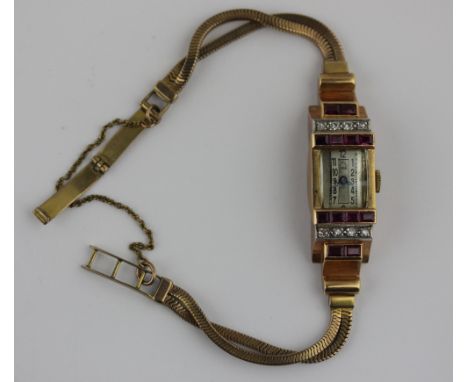 A 9ct gold ruby and diamond bracelet watch