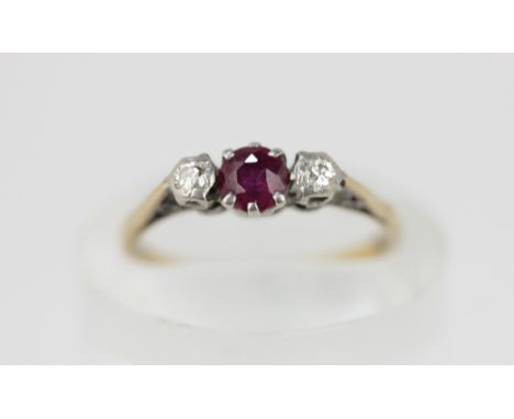 A ruby and diamond three stone ring, set in 18ct gold