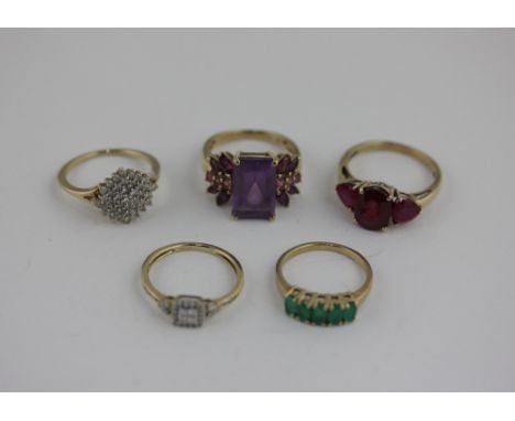 Two diamond cluster rings set in 10ct gold, together with a ruby three stone ring and two other gemset rings set in 9ct gold 