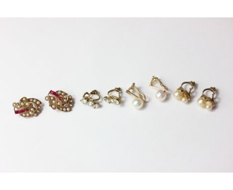 A pair of ruby and pearl ear clips; a pair of paste ear clips; two pairs of pearl ear clips; a pair of split pearl ear clips