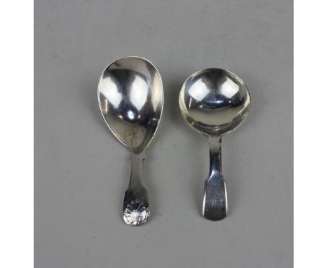 A George III silver caddy spoon pear shaped bowl with shell terminal, London 1816 and another later silver caddy spoon with F