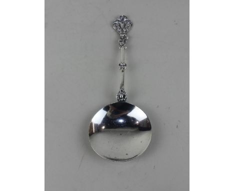 An Edward VII silver wine spoon circular bowl and cast handle with figure and trefoil terminal, maker William Hutton &amp; So