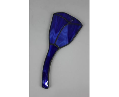 An Art Nouveau blue enamel and lead glazed hand mirror formed as a flower