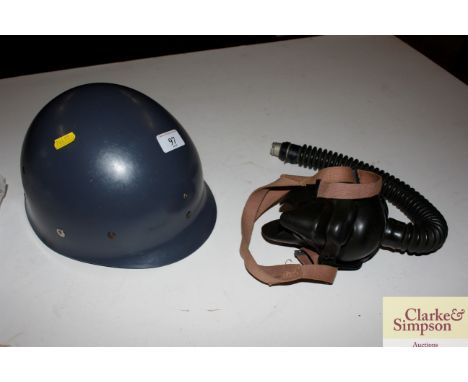 A USAAF pilots oxygen mask; and a military helmet