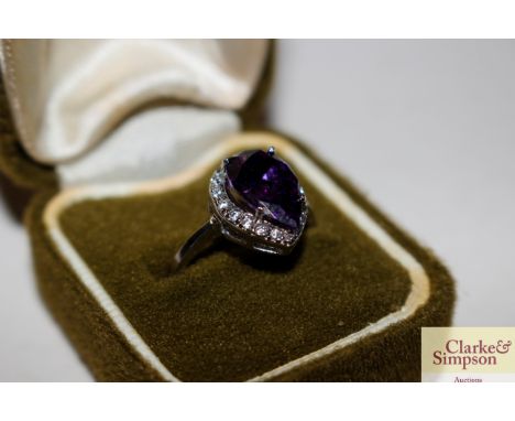 A 925 ring set amethyst coloured stone in green box 